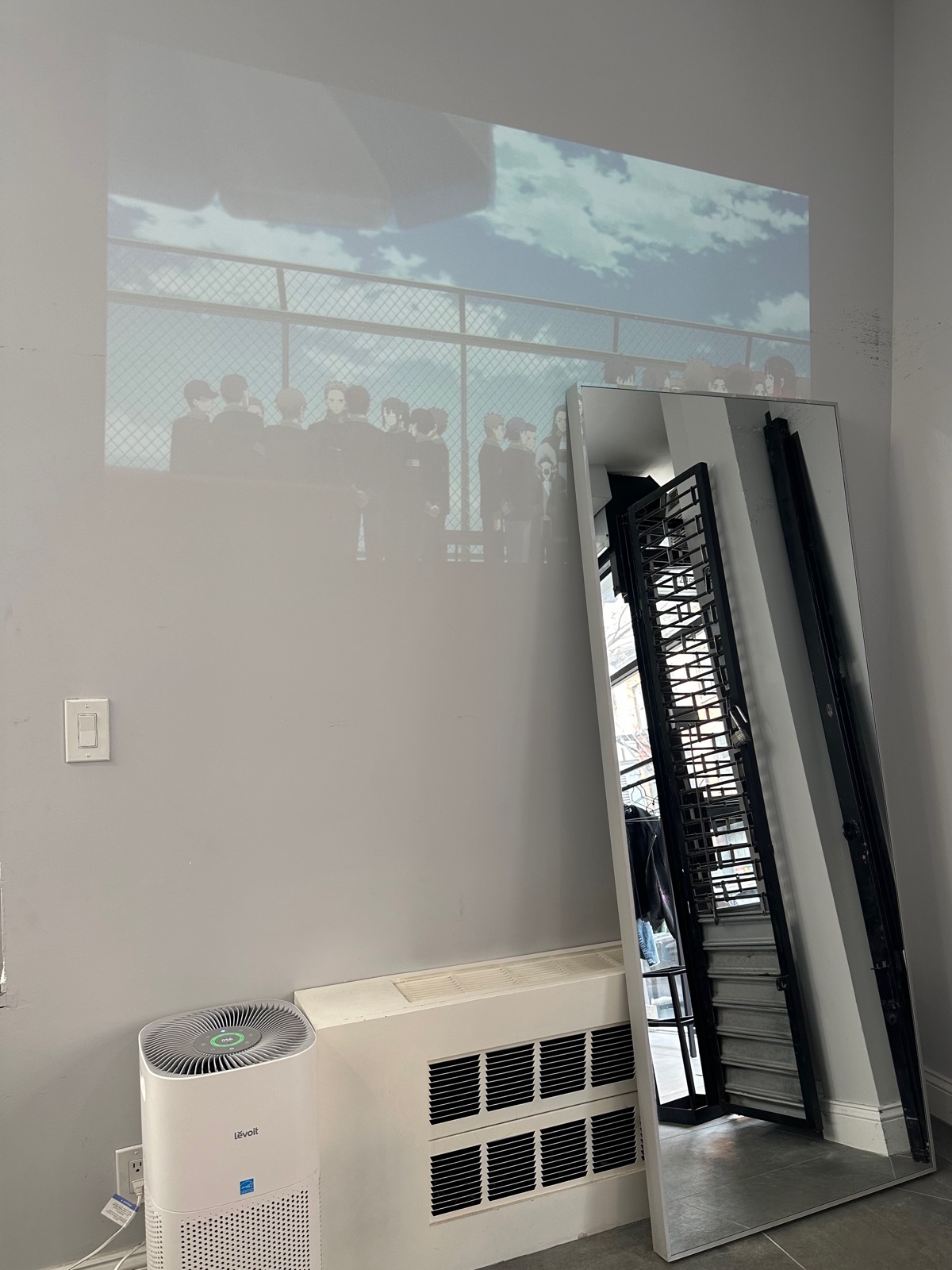 Waiting area of assort new york playing the projector